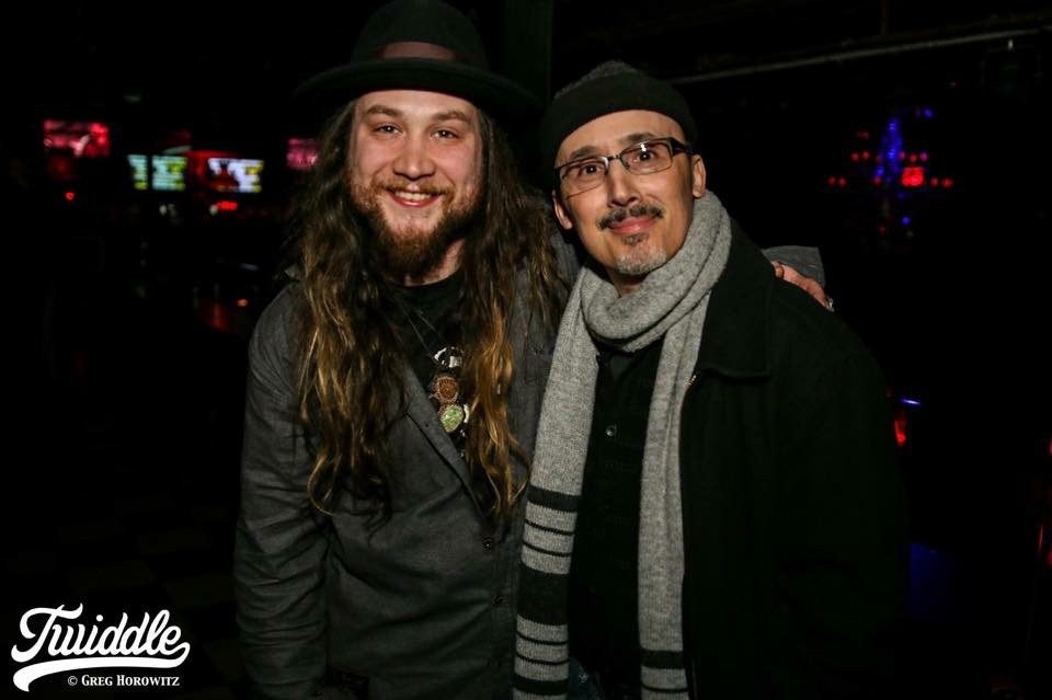 Two men posing for a picture at an event.